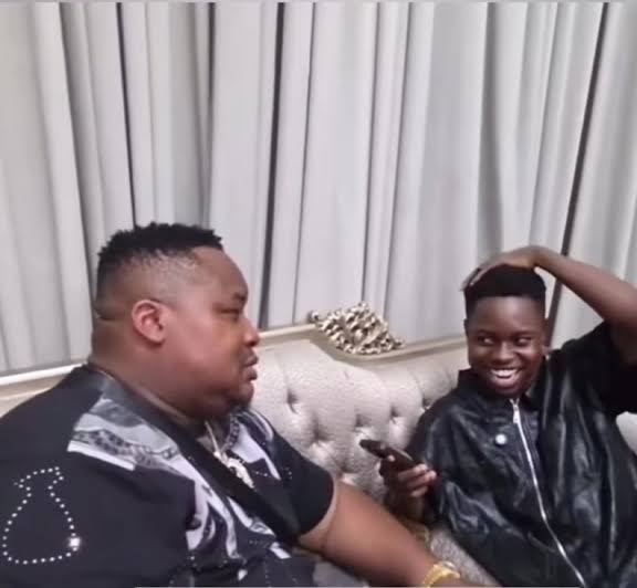 Nigerian Streamer Left Speechless as Cubana Chief Priest Drinks ₦50,000 Voss Water — Sparks Debate on Wealth, Class, and Priorities