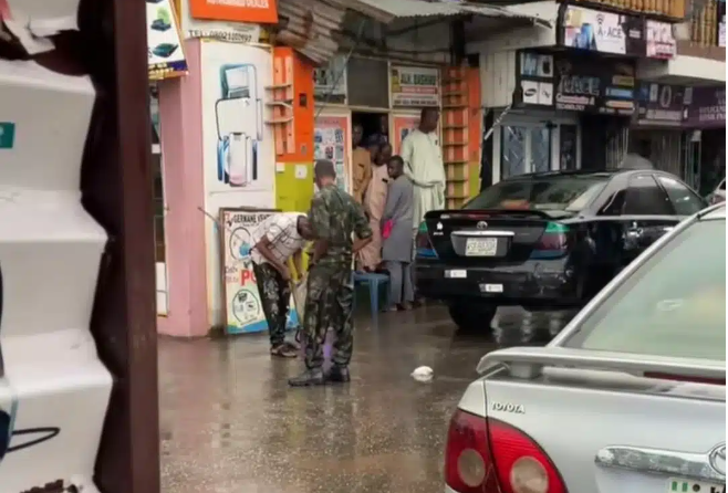 Humiliation in the Rain: Soldier Forces Man to Mop Shopping Mall for Wearing Military Camouflage