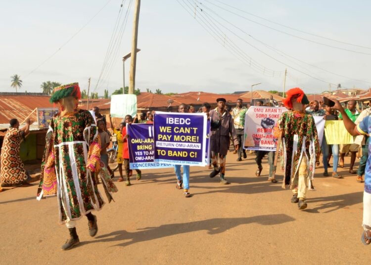busterblog - Power Play: Masquerades Storm Streets in Dramatic Protest Against Electricity Tariff Hike in Kwara